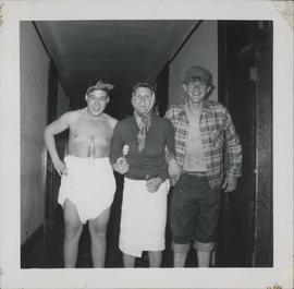 Three guys acting up,dressed in costume