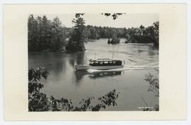 A tour boat traveling through the water, Ivy Lea