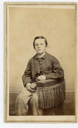 Young person sitting inscribed on back - Libbie