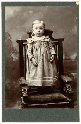 Young child standing on a chair