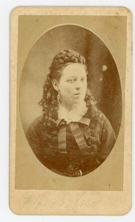 Shoulder portrait of young woman with long hair