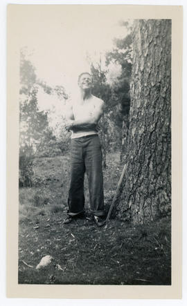 Man beside a pine tree, inscribed “Me (Bob Wood)/ Frizzle Island/ Charleston Lake