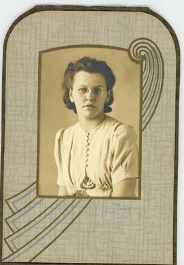 Studio folder of young woman with glasses, unidentified.