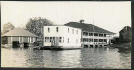 Canoe Club Gananoque with house boat beside it