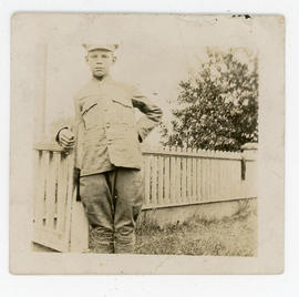 Young man in army jacket and hat, inscribed “Walt”