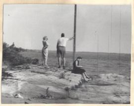 Guest book-photograph of three people by  water in Oct.