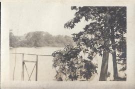 Women covered by a tree branch