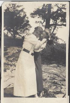 Two women standing on rock