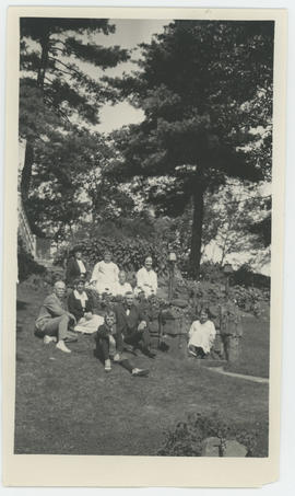 Group sitting on hill