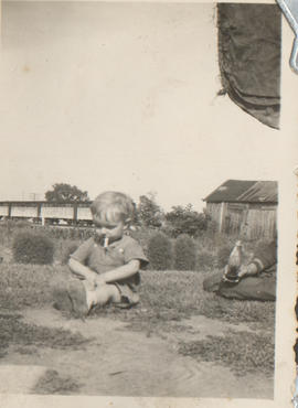 Boy sitting on grass