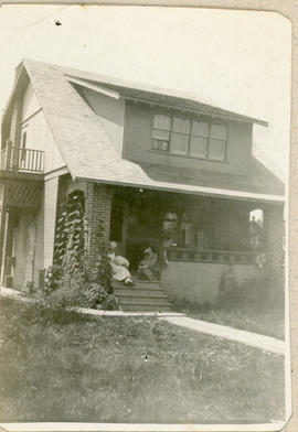 2 women on steps of house